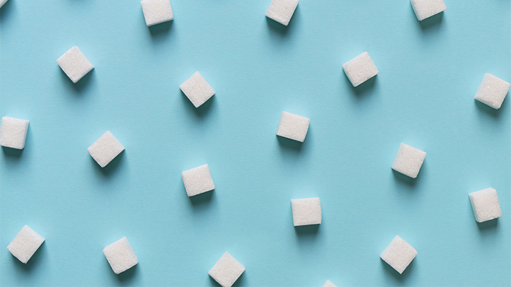 How to pass your glucose test; sugar cubes on a Tiffany blue background