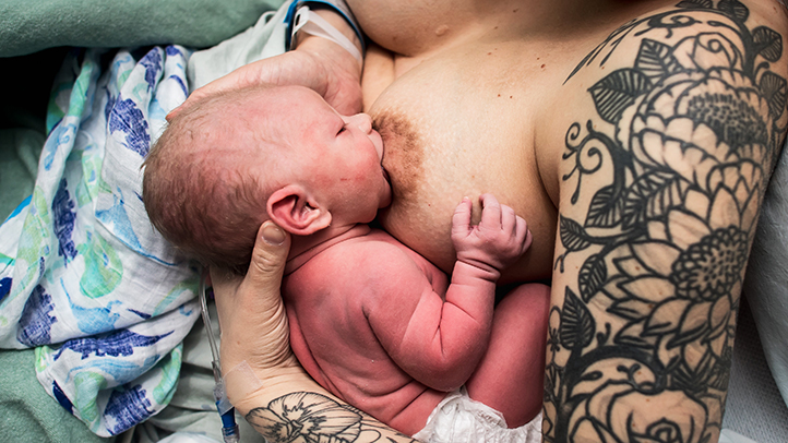 woman breastfeeding baby after a C-section