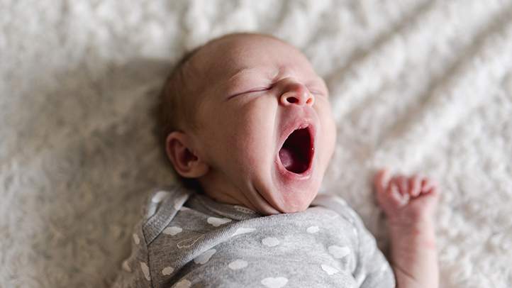 can babies sleep too much, yawning sleeping baby on blanket