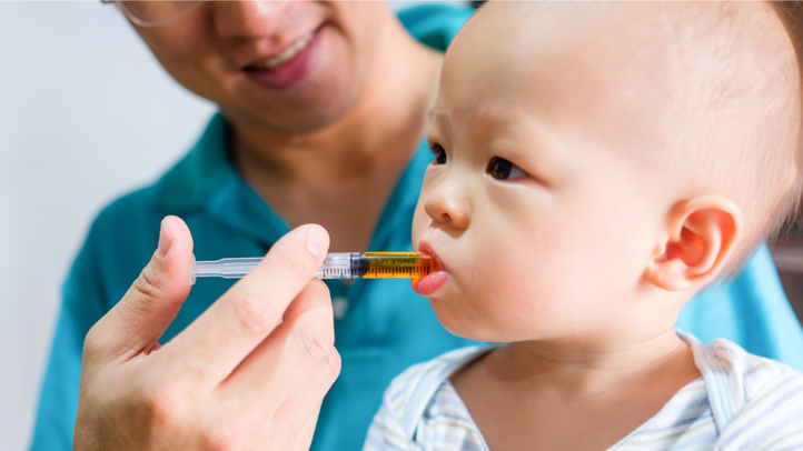 doctor or parent giving baby medicine through a syringe, children's medication safety guidelines