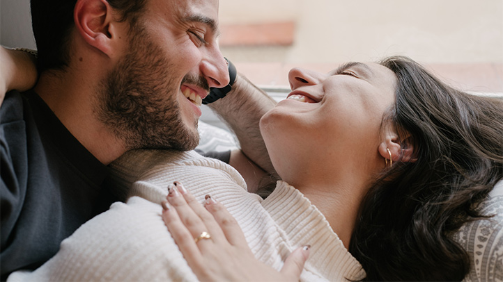 breastfeeding and intimacy, couple smiling at each other 