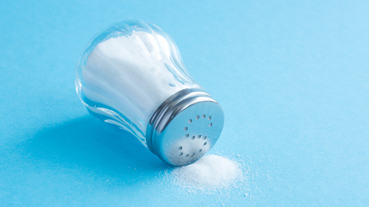 iodine in pregnancy, salt shaker on light blue background