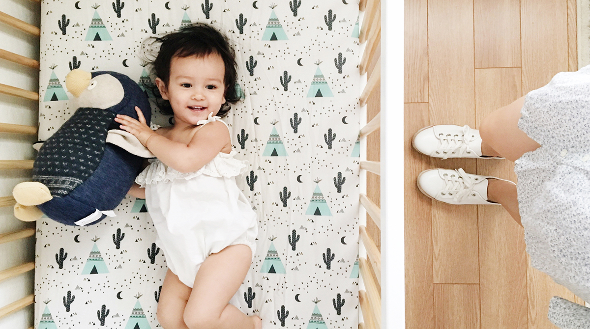 girl awake in crib, toddler resisting bedtime