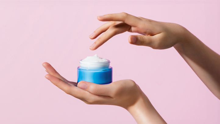 pregnancy-safe skin care guide, jar of face cream in woman's hands