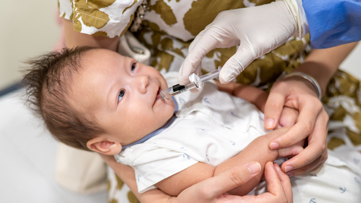 rotavirus vaccine, baby getting an oral vaccine