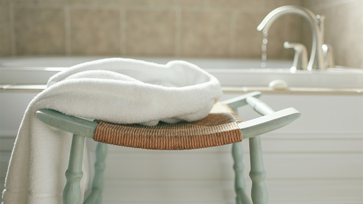 sitz bath, towel next to the bathtub