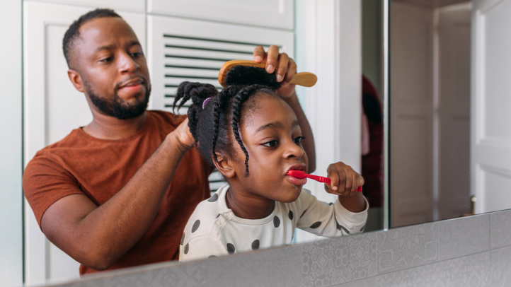 toddler routines and daily schedules, dad doing toddler girl's hair