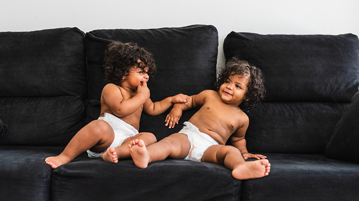 potty training twins, twin toddlers in diapers on couch