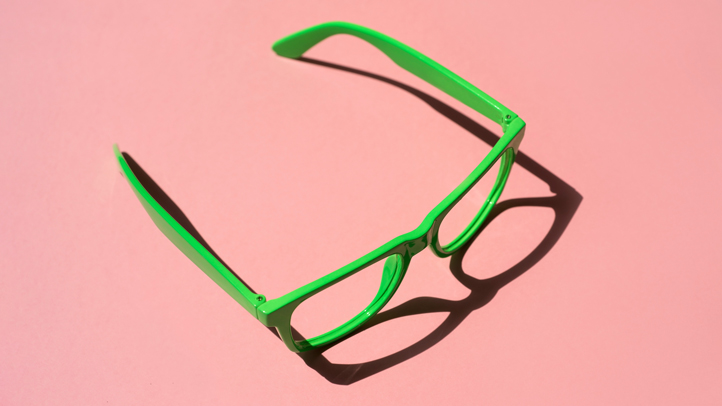 green glasses on pink background, blurry vision during pregnancy