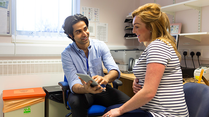 pregnant woman at doctor, things to know about vaccines when pregnant